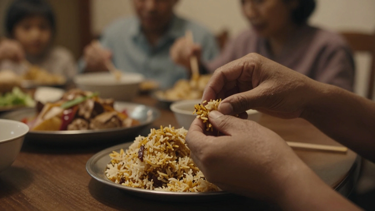 Hand holding a portion of seasoned rice for eating.
